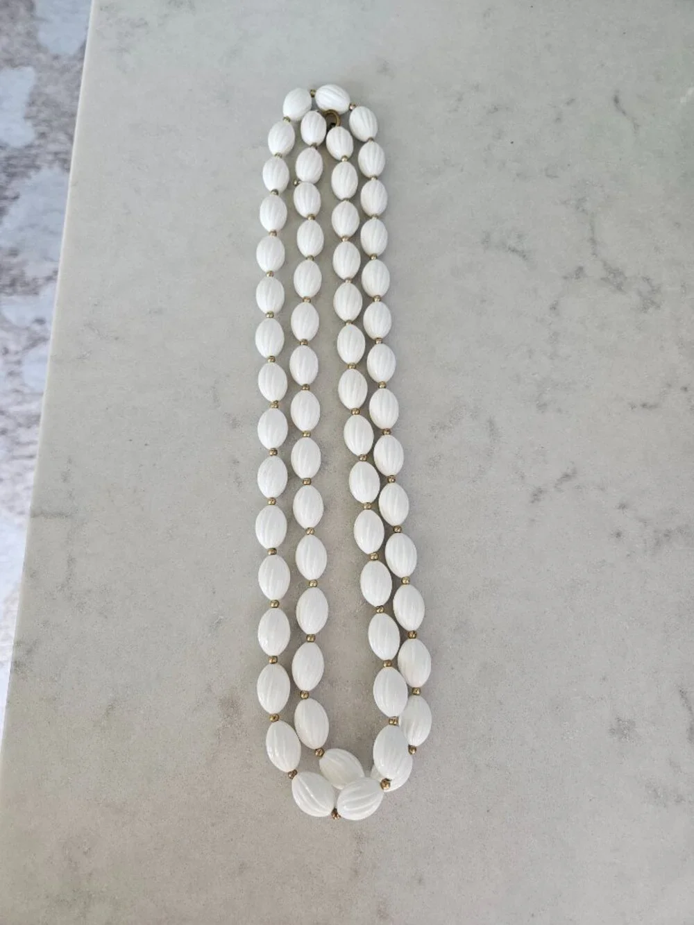 RARE AND VINTAGE WHITE RIBBED OVAL BEAD 48